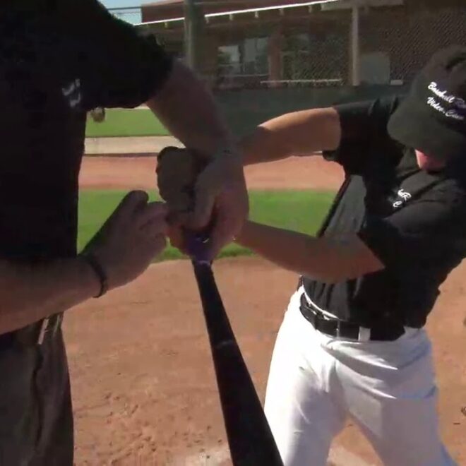 The batter hits a pitch off of his body, the ball pops into the air and