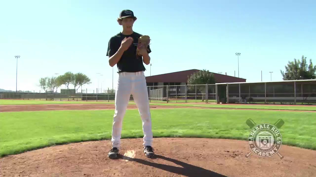 Pitcher Goes to his Mouth While Straddling the Rubber Baseball Rules