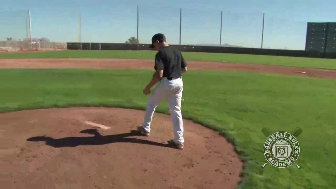 This move is close to a balk but is legal. Baseball Rules Academy