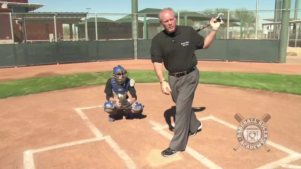 When is a Batter Out for Swinging at a Pitch while Stepping Out of the